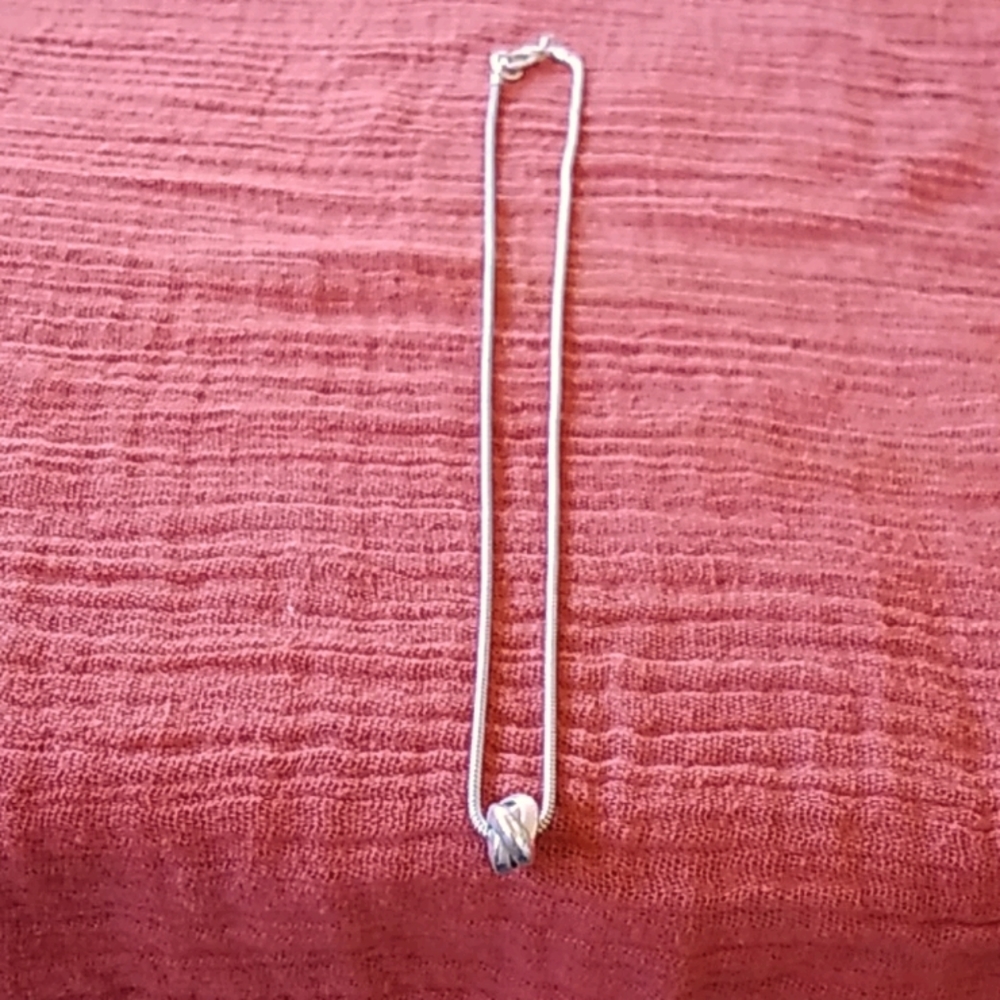 Artisan made silver bead necklace.